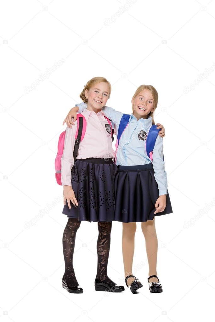 schoolgirls with school backpacks