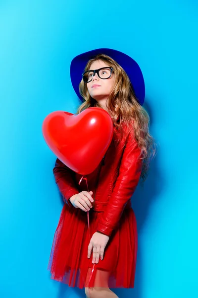 girl with heart shaped balloon