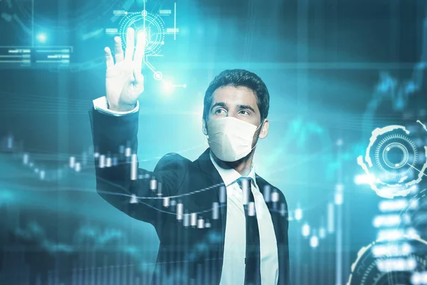 COVID-19 and the global economy. A modern businessman in a medical mask manages business processes using digital technology. Remote business.