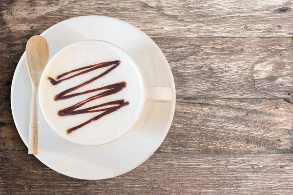 White cup of coffee on brown table in cafe. — Stock Photo, Image