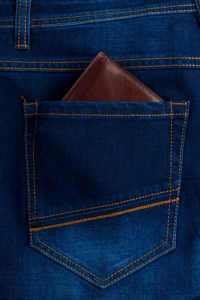 Men's wallet in the back pocket of jeans close-up — Stock Photo, Image