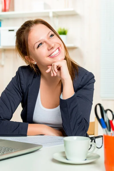 Dreamy portrait of a happy beautiful girl in the office vertical — Stock Photo, Image