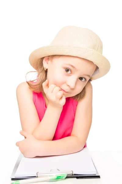 Portrait of a girl in a hat with a notebook on a white backgroun — Stock Photo, Image