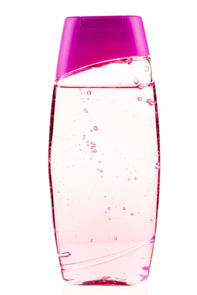 Gel de banho em uma garrafa rosa close-up em um fundo branco isola — Fotografia de Stock