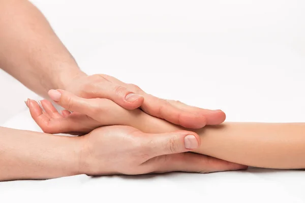 Acariciando massagem de mãos perto em um fundo branco — Fotografia de Stock