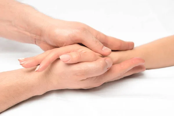 Vrouwelijke hand in mannelijke handen close-up, strelen massage — Stockfoto