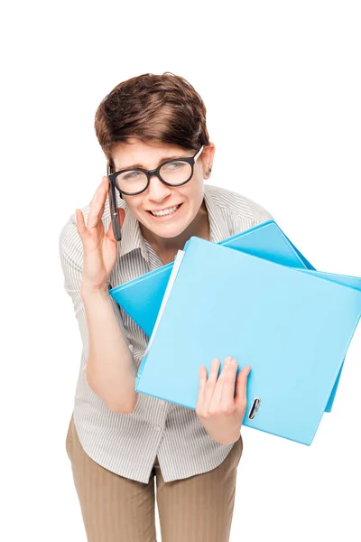 Office worker busy working with folders and phone on a white bac — Stock Photo, Image