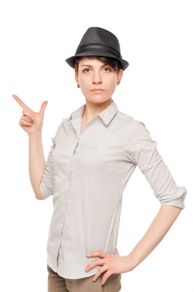 Woman in a black hat shows his finger to the side isolated on wh — Stock Photo, Image
