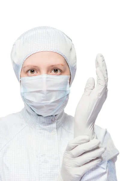 Medical worker wears sterile clothes on a white background isola — Stock Photo, Image