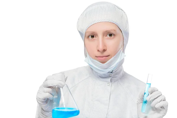 Woman in a protective mask with test-tubes with liquid on white — Stock Photo, Image