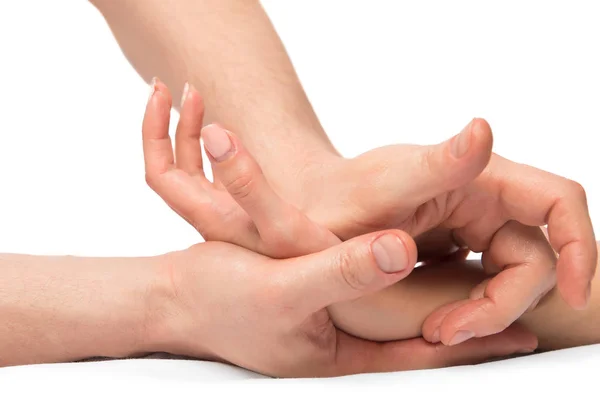 Amassar as mãos de massagem, tiro de close-up em um fundo branco — Fotografia de Stock