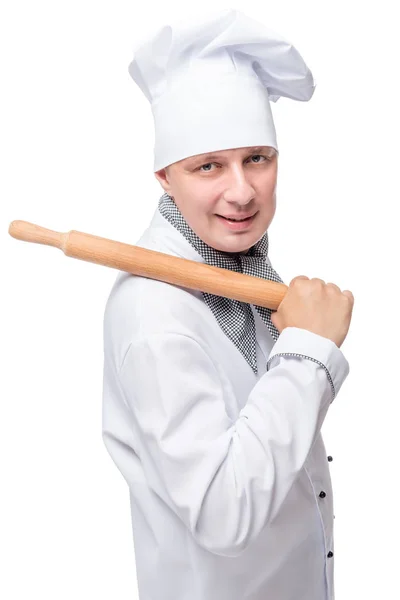 Retrato vertical de um cozinheiro com um rolo para isolar a massa — Fotografia de Stock