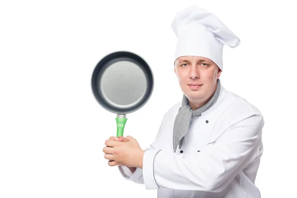 Koken in een pak met lege koekenpan poseren — Stockfoto