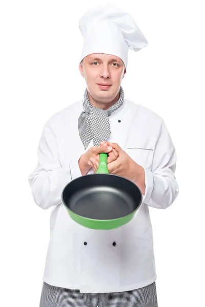 Chef showing empty pan in the studio on a white background — Stock Photo, Image