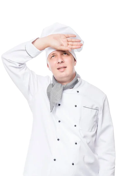 Tired cook wipes the sweat from his forehead with a white backgr — Stock Photo, Image