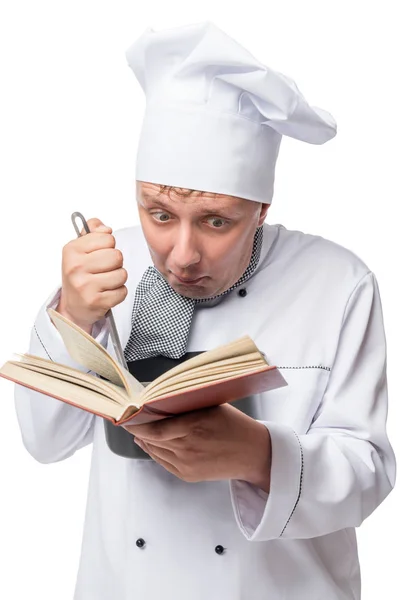 Crazy cook with a pan and a book of recipes on a white backgroun — Stock Photo, Image