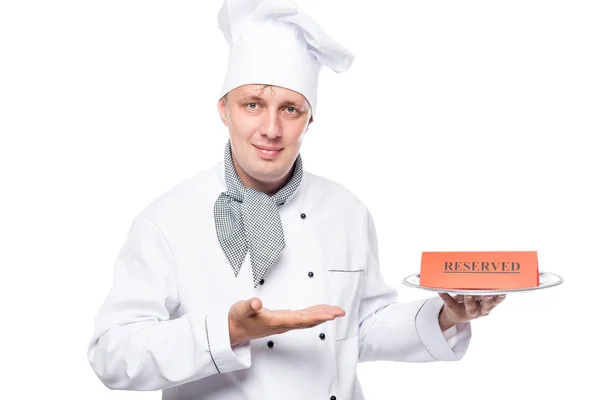 Pretty professional cook with a tray on which there is a reserve — Stock Photo, Image