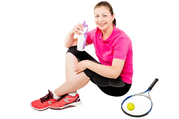 Happy tennis player after training with water bottle sitting on — Stok Foto