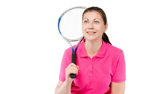 Chica con una raqueta mira hacia arriba sobre un fondo blanco — Foto de Stock