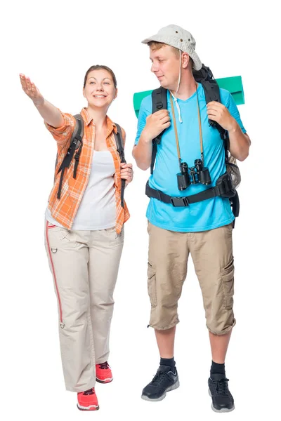 Feliz pareja de turistas con mochilas sobre un fondo blanco en — Foto de Stock