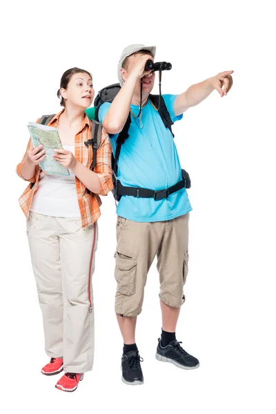 Active young couple of travelers with backpacks go hiking on a w — Stock Photo, Image