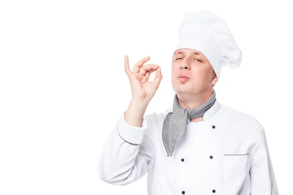 Chef masculino mostrando gesto delicioso, em um fundo branco — Fotografia de Stock