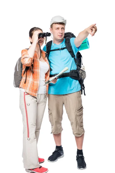 Uomo mostra la direzione di una donna escursionista con binocolo su un whi — Foto Stock