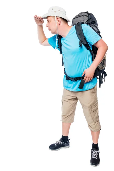 Homem com uma mochila de comprimento total olhando para a distância em — Fotografia de Stock