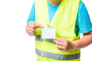 Sarı bir yelek bir işçi elinde rozet