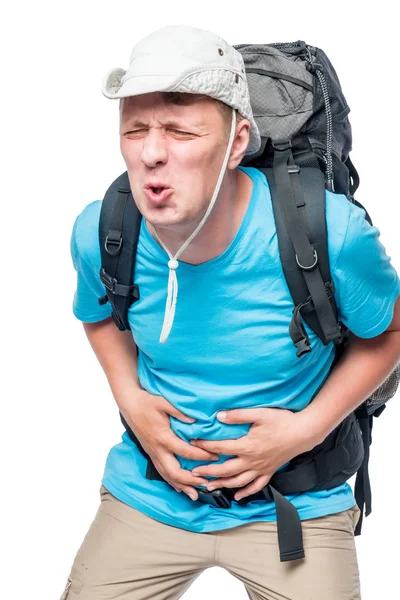 Man with a sharp pain in the stomach in a hike against a white b — Stock Photo, Image