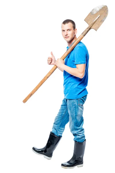 Working man with a shovel goes to dig on a white background — Stock Photo, Image