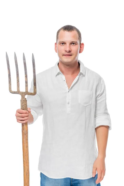 Vertical portrait of a farmer with forks in his hand on a white — Stock Photo, Image