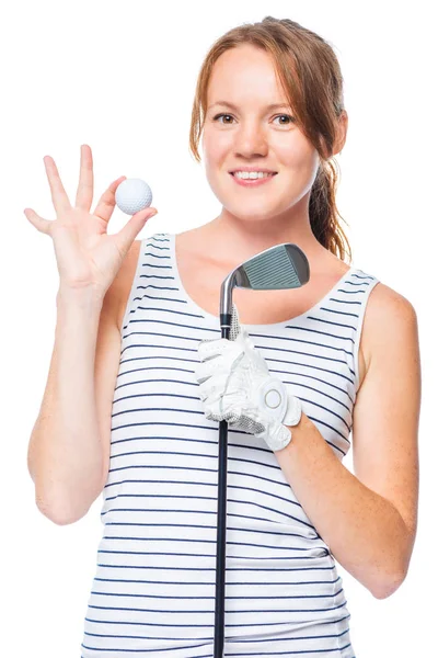 Golfista segurando um taco de golfe e mostrando uma bola branca no studi — Fotografia de Stock