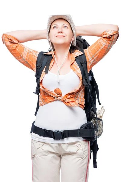 Senhora com uma mochila relaxa olhar para cima em um fundo branco — Fotografia de Stock