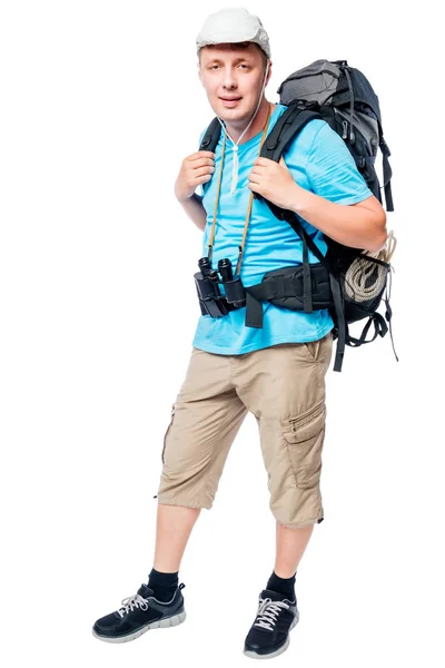 Caminante con una mochila apoyada sobre un fondo blanco —  Fotos de Stock