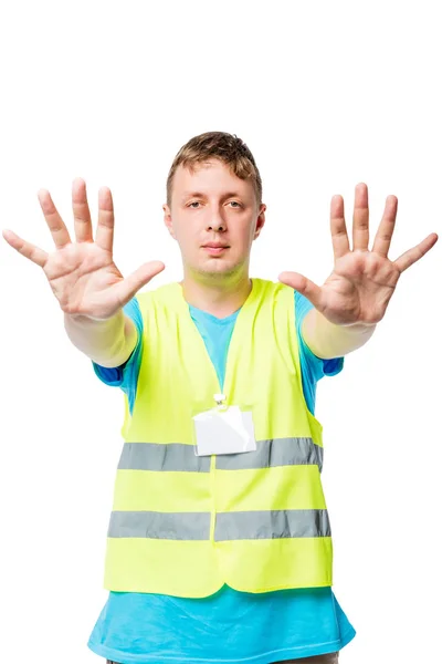 Man in vest toont handen met gebaar van Stop op witte achtergrond — Stockfoto