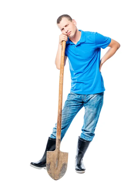 Tired farmer holding a sick back on a white background — Stock Photo, Image