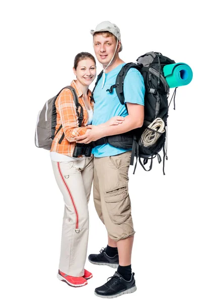 Couple souriant de touristes avec sacs à dos en studio sur bac blanc — Photo