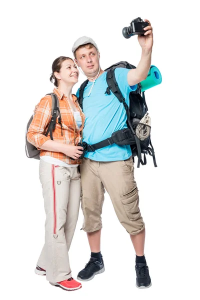 Young couple of extreme tourists doing selfie on camera on white — Stock Photo, Image