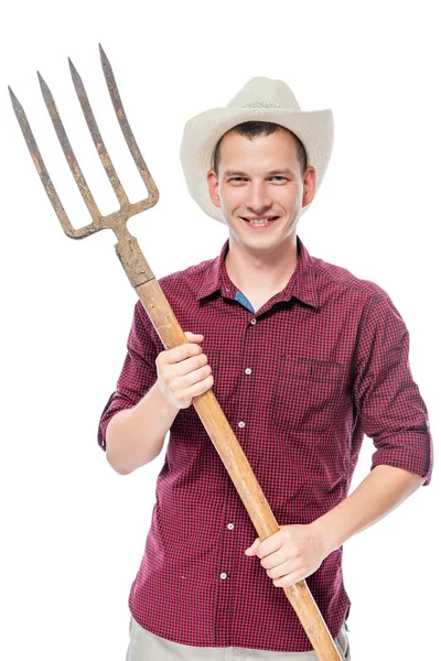 Young successful farmer in a red shirt with pitchforks isolated — Stock Photo, Image