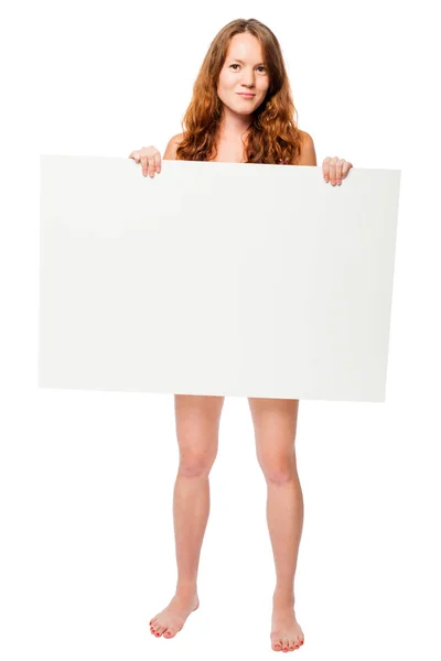 Barefooted naked woman hiding behind a white billboard in the st — Stock Photo, Image