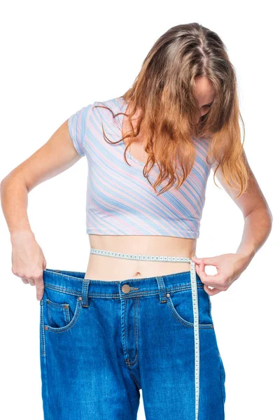 Woman with a measuring tape on a white background — Stock Photo, Image