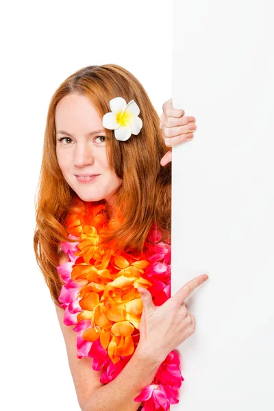 Woman in floral Hawaiian Lei shows a finger on an empty poster — Stock Photo, Image