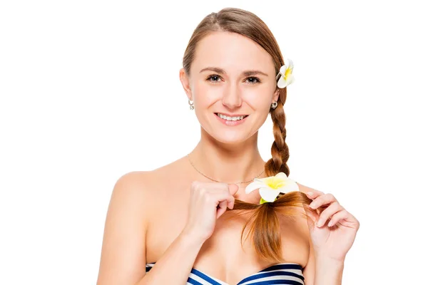 Horizontal portrait of a girl with flowers in her hair on a whit — Stock Photo, Image