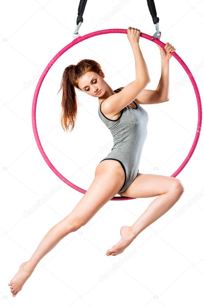 Portrait of beautiful girl in body in air ring on white backgrou