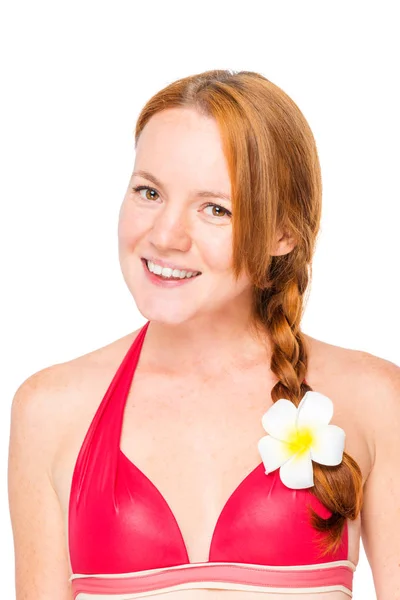 Close-up portrait of a woman with a plumer flower in her hair on — Stock Photo, Image