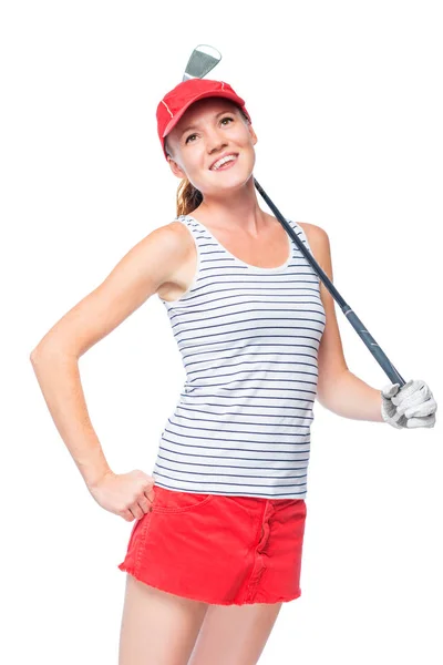 Chica alegre con un palo de golf en una gorra roja y falda en un blanco —  Fotos de Stock