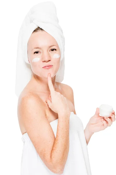 Girl with face cream posing on white background after shower — Stock Photo, Image