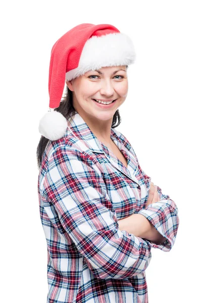 Mujer feliz en pijama caliente a cuadros en una gorra de Navidad en un blanco —  Fotos de Stock