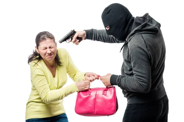 Nebezpečného ozbrojeného lupiče krade pytel od ženy — Stock fotografie
